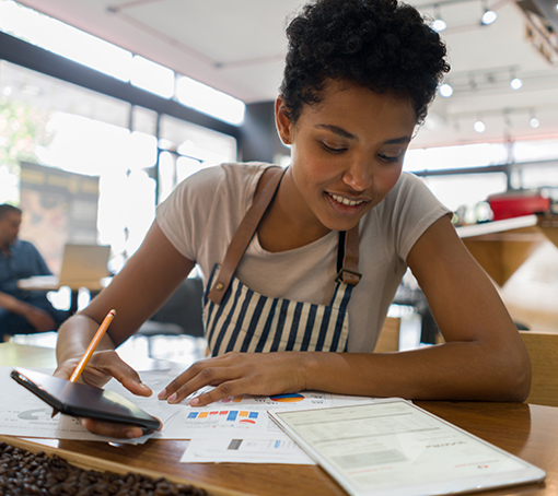 business owner calculating her business costs