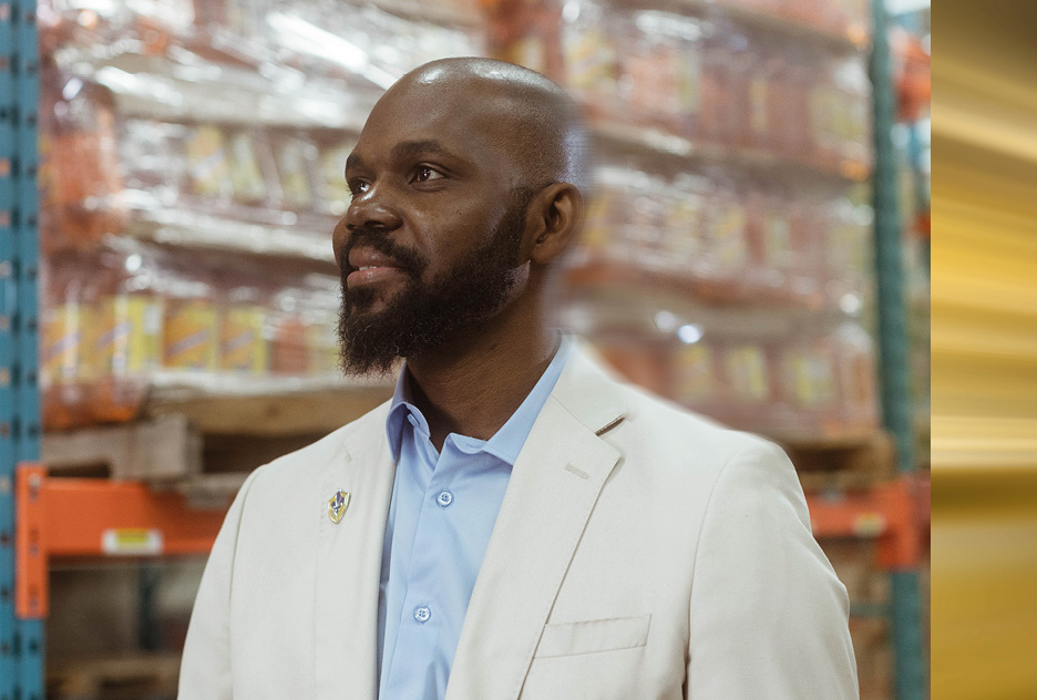 Isaaq Bosquet of Demasara standing in his warehouse