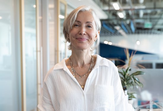 Woman entrepreneur posing proudly in her business offices