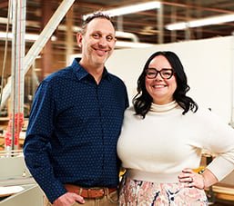 Carmi and Mike Mooser in a wood workshop