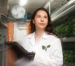 Alida Burke, The Growcer owner, surrounded by plants