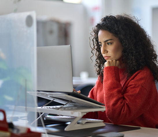 young woman attentively studying online