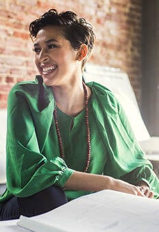 Smiling woman with green blouse