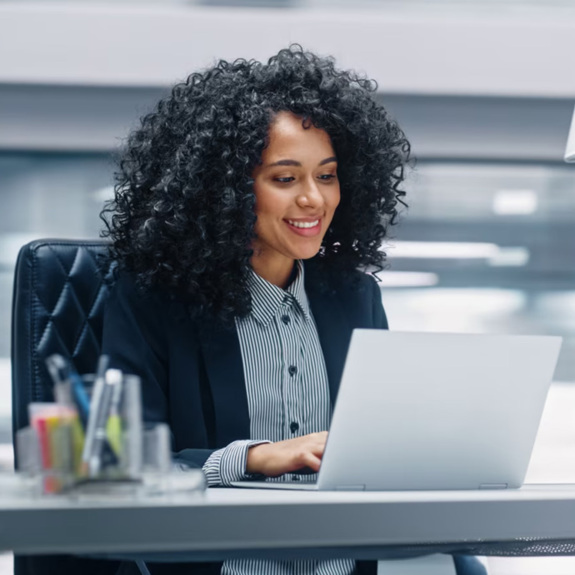 Woman working desk computer report esg dei