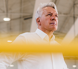 Senior entrepreneur standing in his warehouse