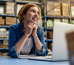 Smiling woman with laptop