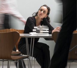 Tired woman in a hectic workplace