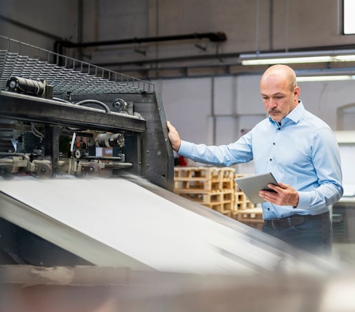 Man evaluating print machinery