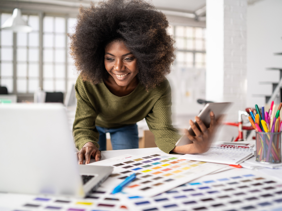 Woman in an office working on a computer