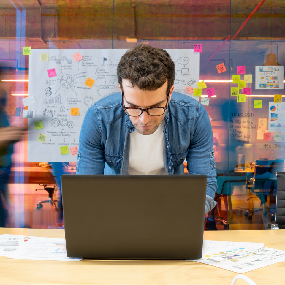 Man working in a creative office using his computer