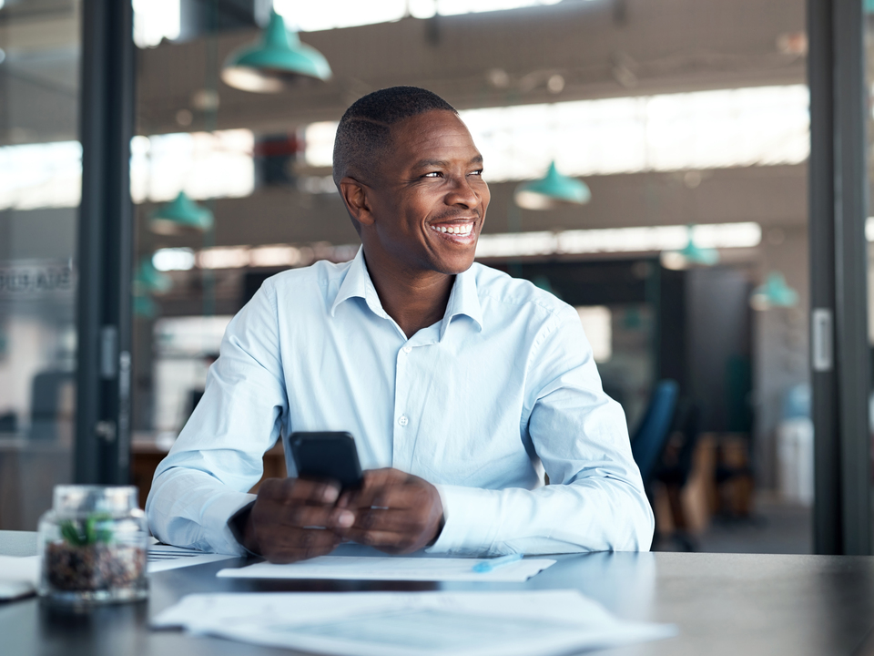 mature businessman using smartphone