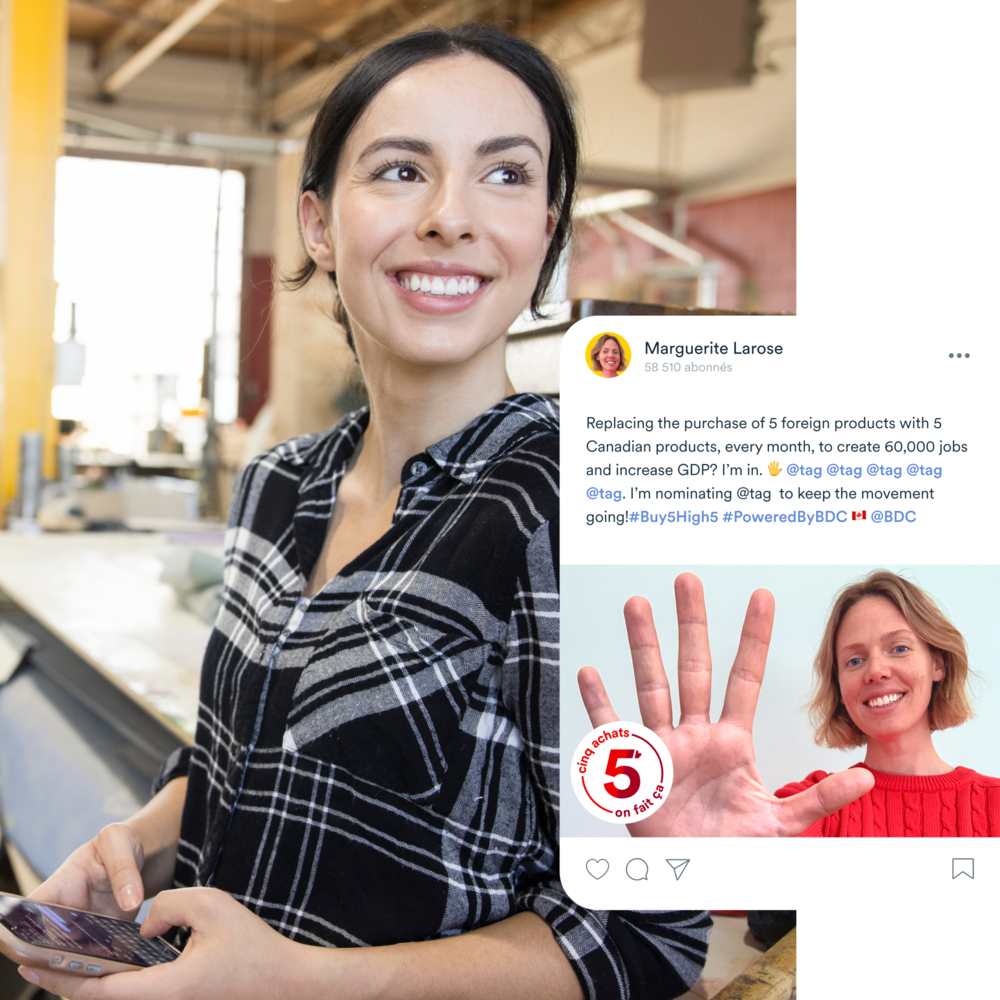 Woman smiling and holding up her hand